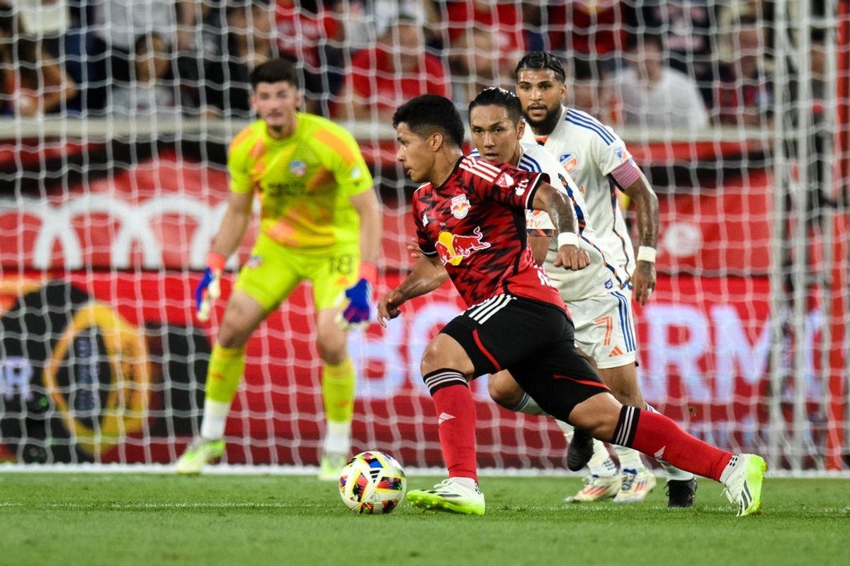 Jul 20, 2024; Harrison, New Jersey, USA; New York Red Bulls midfielder Wikelman Carmona (19) makes a move against FC Cincinnati forward Yuya Kubo (7) during the first half at Red Bull Arena. Mandatory Credit: John Jones-USA TODAY Sports