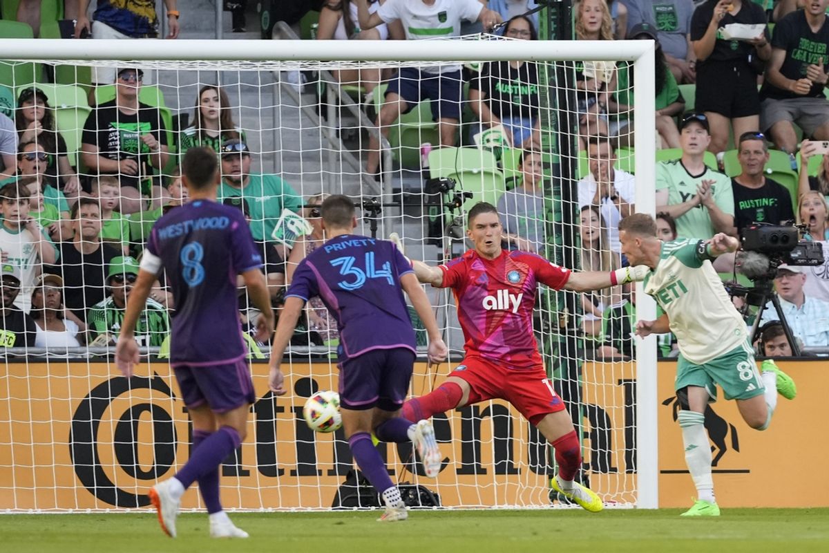 Jul 20, 2024; Austin, Texas, USA; Austin FC midfielder Alexander Ring (8) scores a goal on Charlotte FC goalkeeper Kristijan Kahlina (01) during the first half at Q2 Stadium. Mandatory Credit: Scott Wachter-USA TODAY Sports