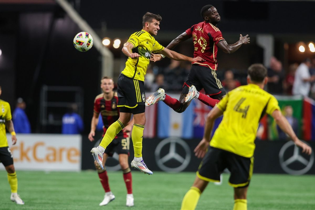Jul 20, 2024; Atlanta, Georgia, USA; Atlanta United forward Jamal Thiare (29) and Columbus Crew defender Yevhen Cheberko (21) go up for a header in the first half at Mercedes-Benz Stadium. Mandatory Credit: Brett Davis-USA TODAY Sports