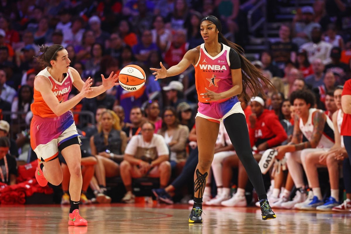 Jul 20, 2024; Phoenix, AZ, USA; Team WNBA forward Angel Reese (5) passes the ball to Team WNBA guard Caitlin Clark (22) during the first half against the USA Women's National Team at Footprint Center. Mandatory Credit: Mark J. Rebilas-USA TODAY Sports
