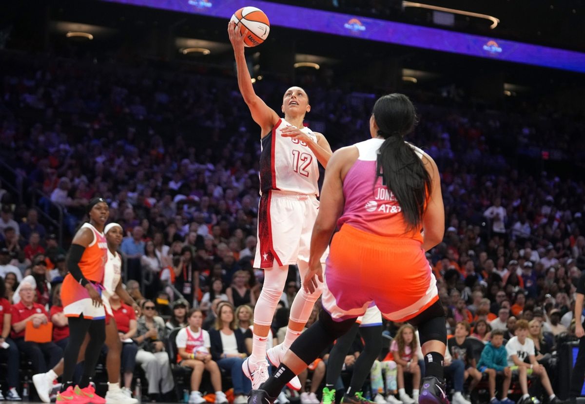 Team USA guard Diana Taurasi (12) lays the ball up against Team WNBA during the WNBA All-Star Game at Footprint Center in Phoenix on July 20, 2024.