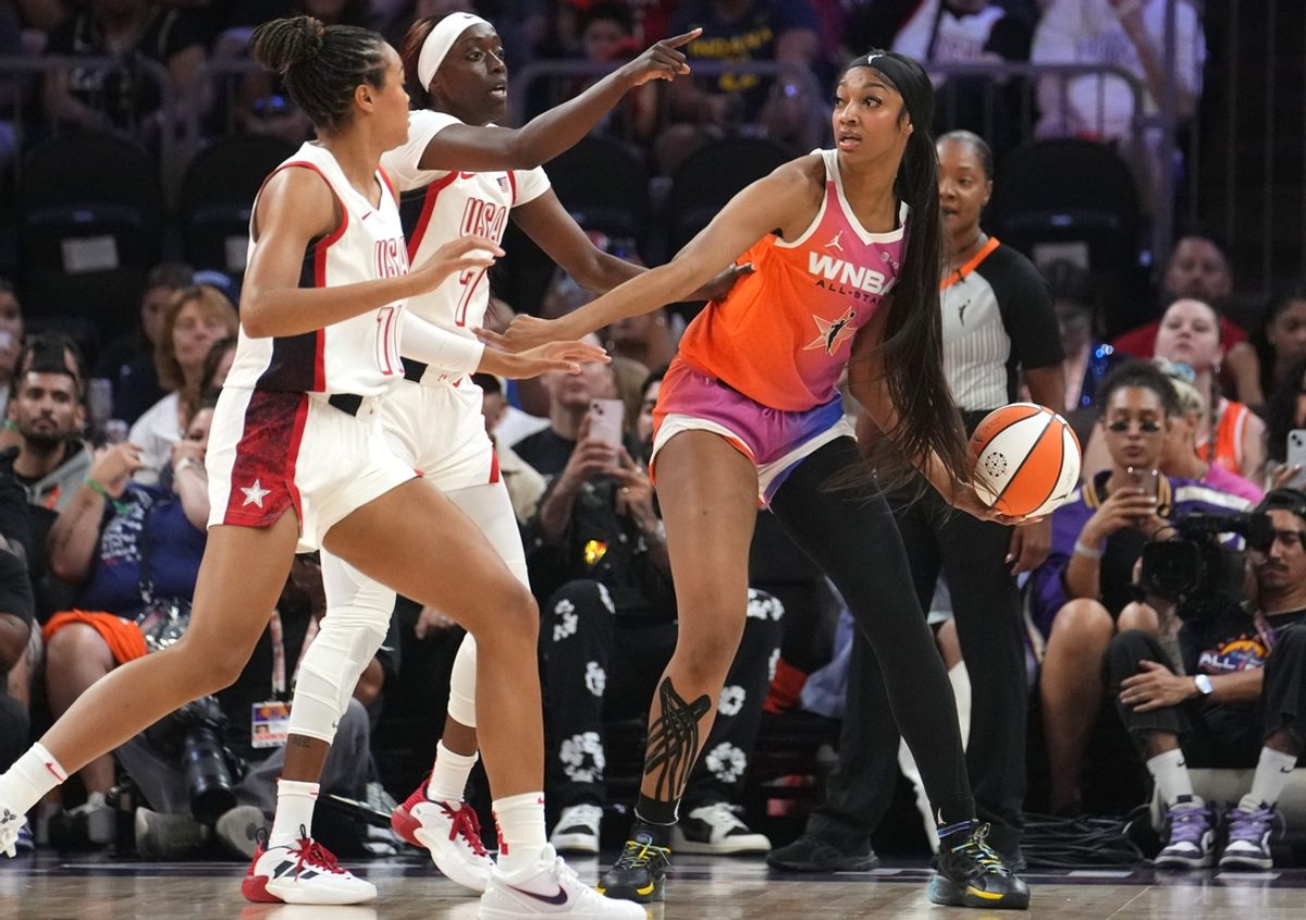 Team USA forward Napheesa Collier (11) and guard Kahleah Copper (7) defend Team WNBA forward Angel Reese (5) during the WNBA All-Star Game at Footprint Center in Phoenix on July 20, 2024.
