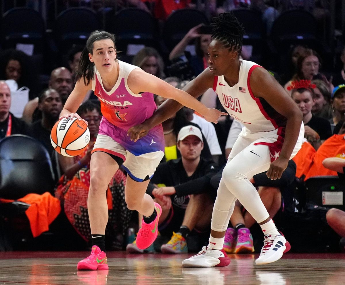 Team WNBA guard Caitlin Clark dribbles against USA Team guard Chelsea Gray during the WNBA All-Star Game in Phoenix on July 20, 2024.
