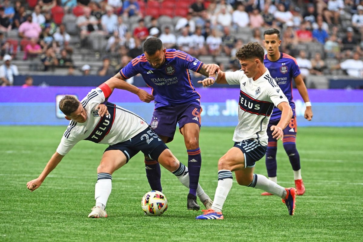 Jul 20, 2024; Vancouver, British Columbia, CAN; Vancouver Whitecaps FC midfielder Ryan Gauld (25) and Houston Dynamo FC midfielder Hector Herrera (16) battle for the ball during the first half at BC Place. Mandatory Credit: Anne-Marie Sorvin-USA TODAY Sports