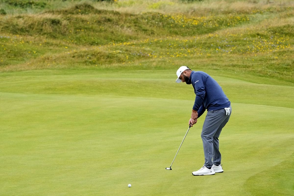 Jul 21, 2024; Ayrshire, SCT; Jon Rahm putts on the fifth green during the final round of the Open Championship golf tournament at Royal Troon. Mandatory Credit: Jack Gruber-USA TODAY Sports