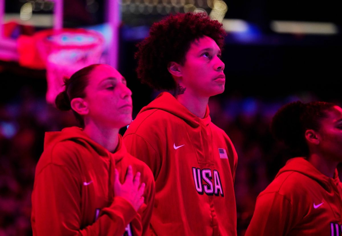 Team USA Diana Taurasi (L) and Brittney Griner listen to the national anthem during the WNBA All-Star Game at Footprint Center in Phoenix on July 20, 2024.