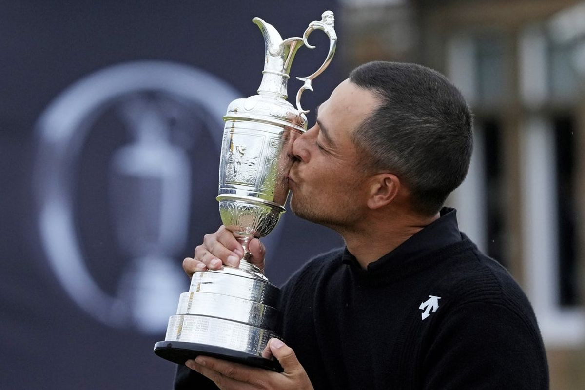 Jul 21, 2024; Ayrshire, SCT; Xander Schauffele celebrates with Claret Jug after winning the Open Championship golf tournament at Royal Troon. Mandatory Credit: Jack Gruber-Imagn Images