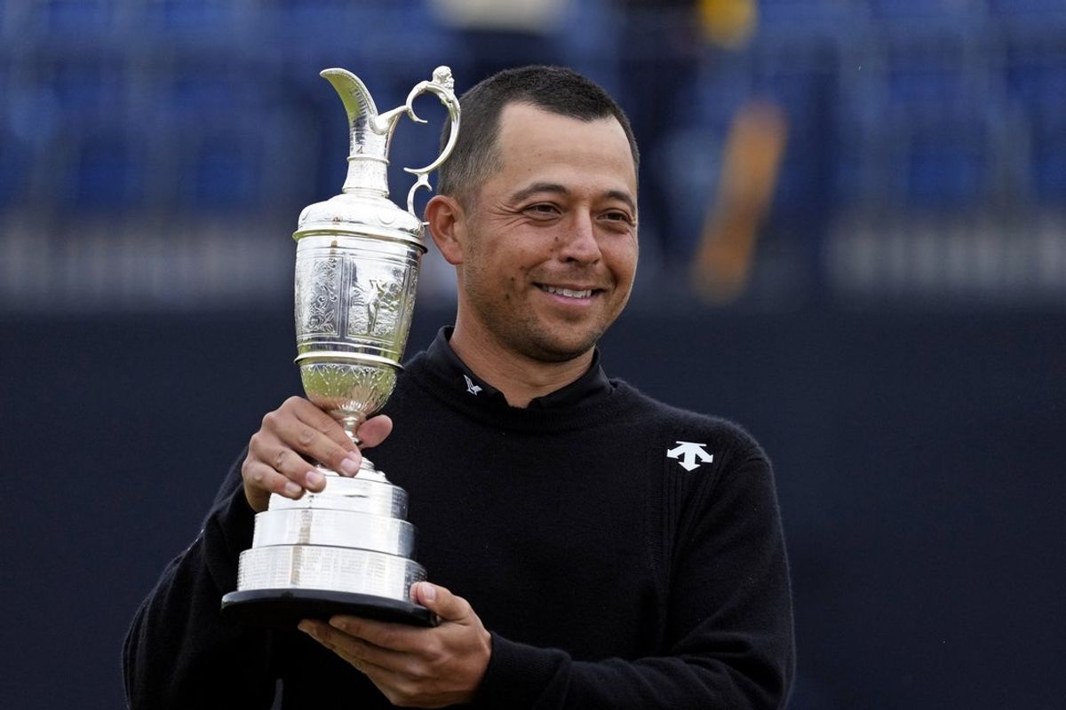 Jul 21, 2024; Ayrshire, SCT; Xander Schauffele celebrates with Claret Jug after winning the Open Championship golf tournament at Royal Troon. Mandatory Credit: Jack Gruber-Imagn Images