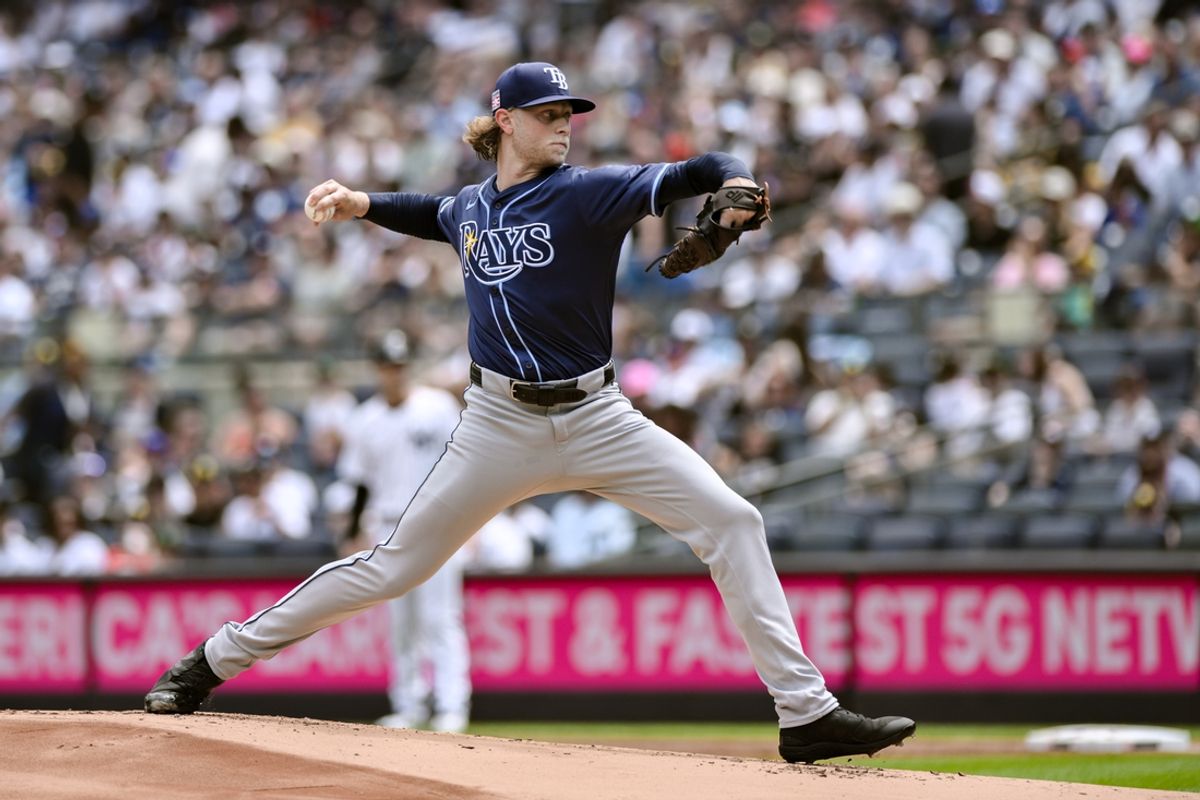 Jul 21, 2024; Bronx, New York, USA; Tampa Bay Rays pitcher Shane Baz (11) throws against the New York Yankees during the first inning at Yankee Stadium. Mandatory Credit: John Jones-USA TODAY Sports