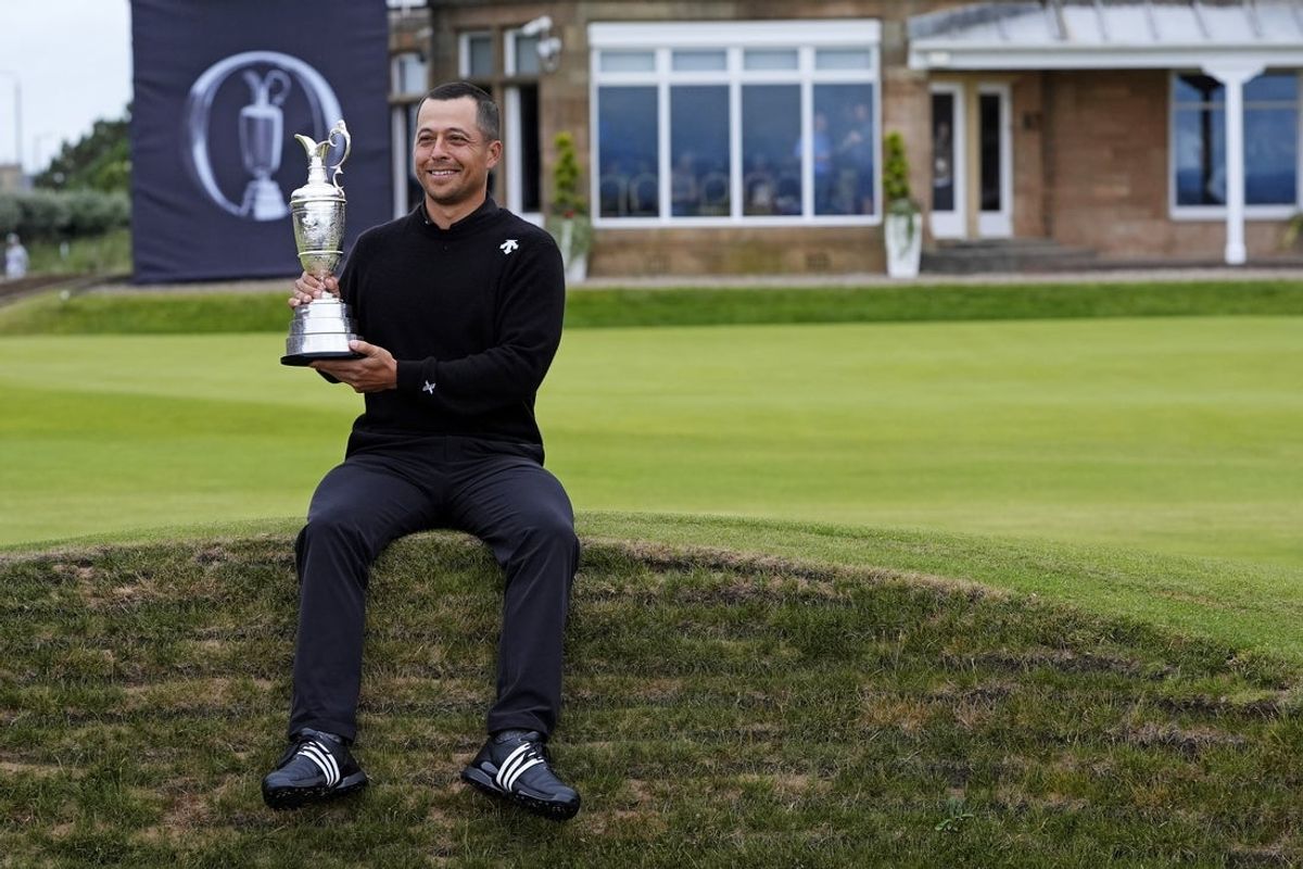 Jul 21, 2024; Ayrshire, SCT; Xander Schauffele poses with Claret Jug after winning the Open Championship golf tournament at Royal Troon. Mandatory Credit: Jack Gruber-Imagn Images