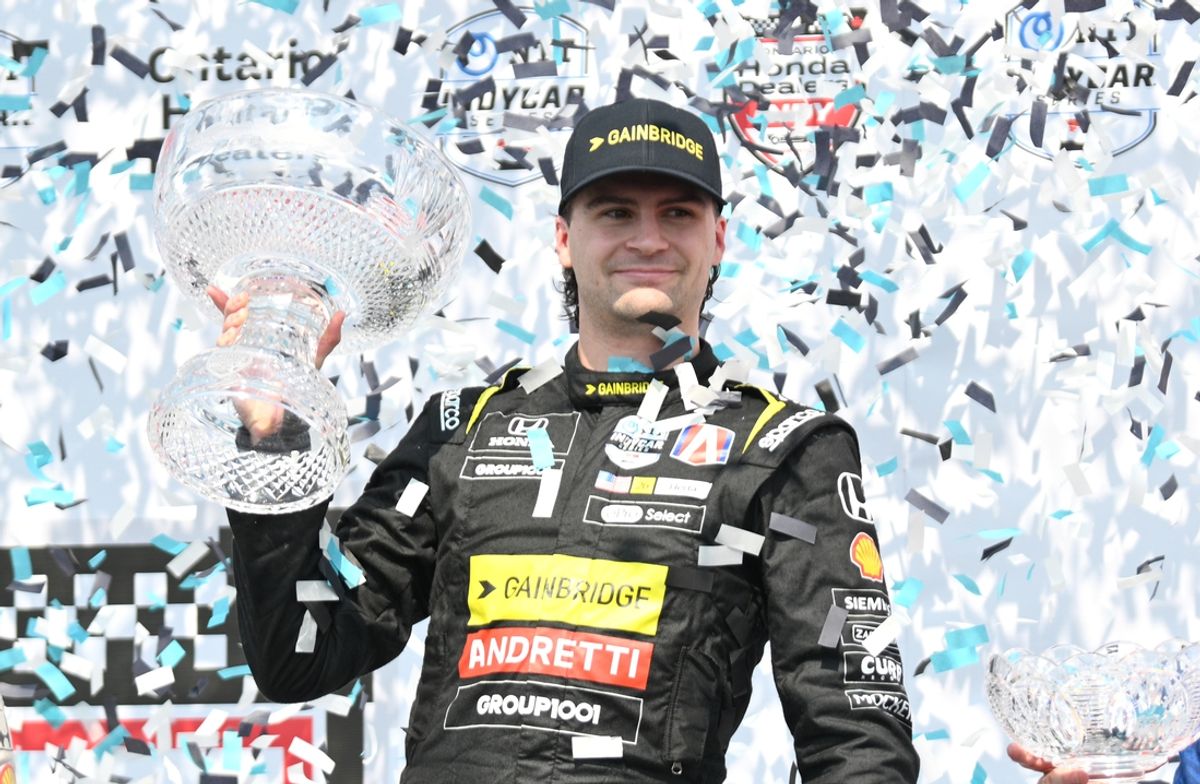 Jul 21, 2024; Toronto, Ontario, CAN;  Andretti Global driver Colton Herta (26) holds the crystal trophy after winning the Honda Dealers Indy at Streets of Toronto. Mandatory Credit: Dan Hamilton-USA TODAY Sports