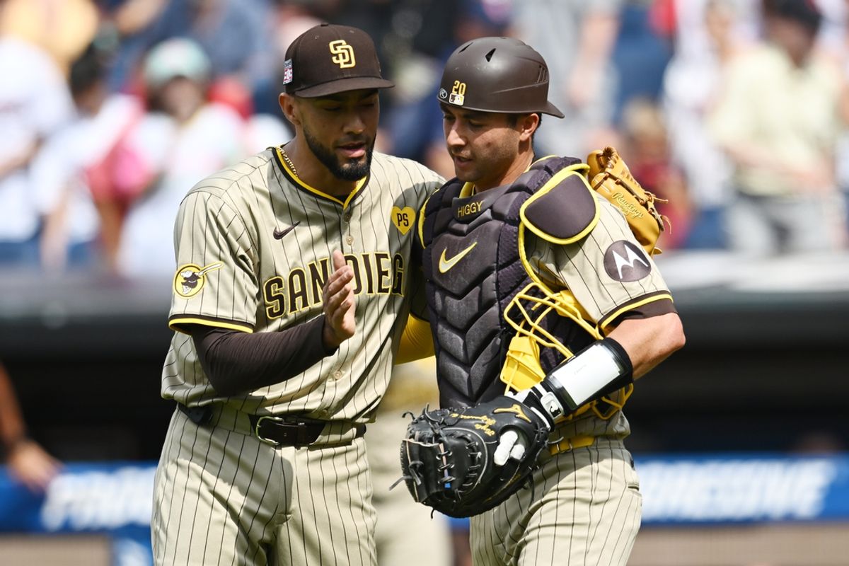 Jul 21, 2024; Cleveland, Ohio, USA; San Diego Padres relief pitcher Robert Suarez (75) celebrates with catcher Kyle Higashioka (20) after the Padres beat the Cleveland Guardians at Progressive Field. Mandatory Credit: Ken Blaze-USA TODAY Sports