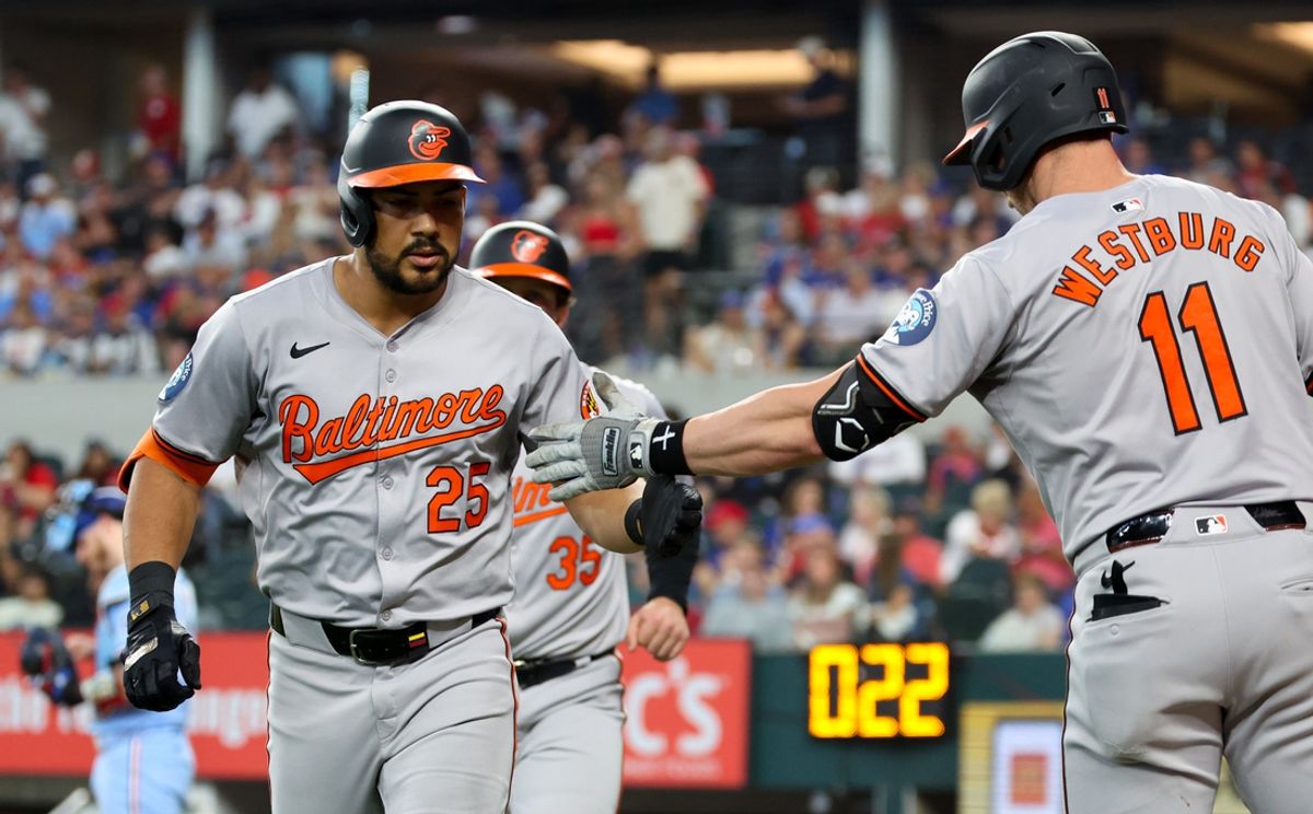 Jul 21, 2024; Arlington, Texas, USA;  Baltimore Orioles right fielder Anthony Santander (25) celebrates with Baltimore Orioles second baseman Jordan Westburg (11) after hitting a two run home run during the eighth inning against the Texas Rangers at Globe Life Field. Mandatory Credit: Kevin Jairaj-USA TODAY Sports