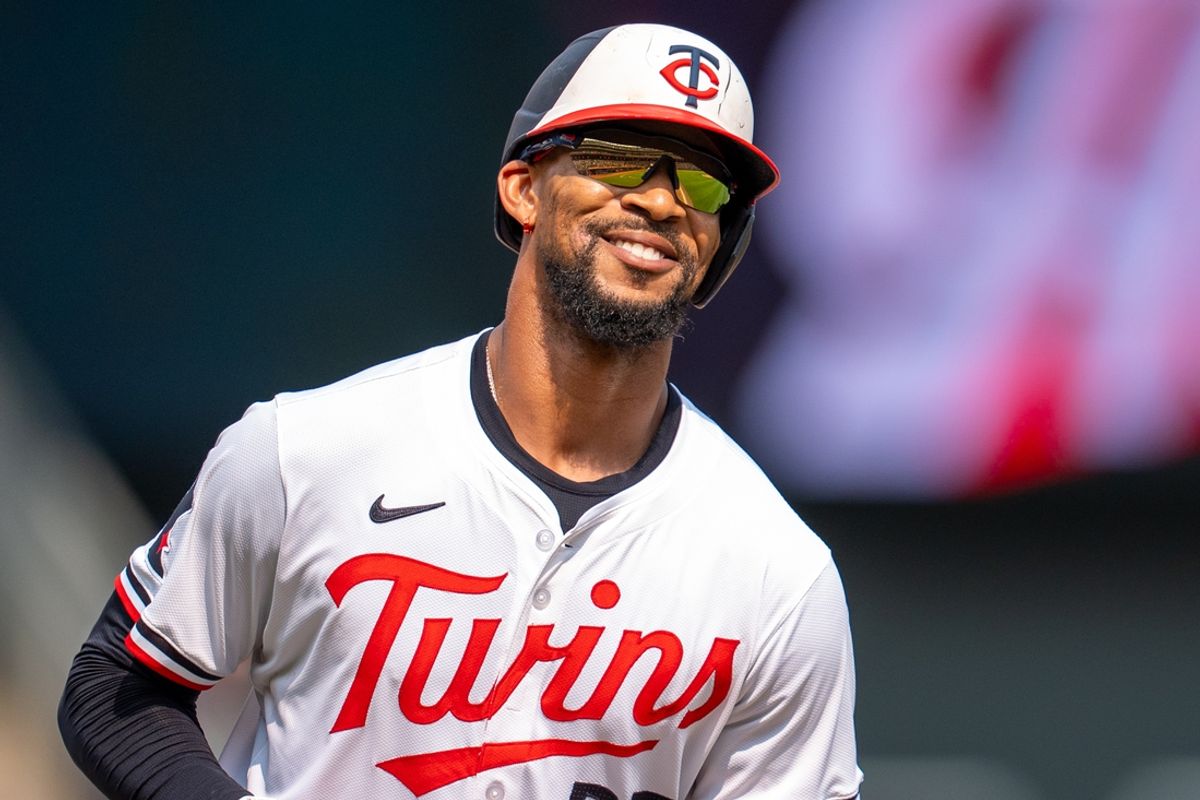 Jul 21, 2024; Minneapolis, Minnesota, USA; Minnesota Twins center fielder Byron Buxton (25) hits a home run in the eighth ninth inning against Milwaukee Brewers at Target Field. Mandatory Credit: Matt Blewett-USA TODAY Sports