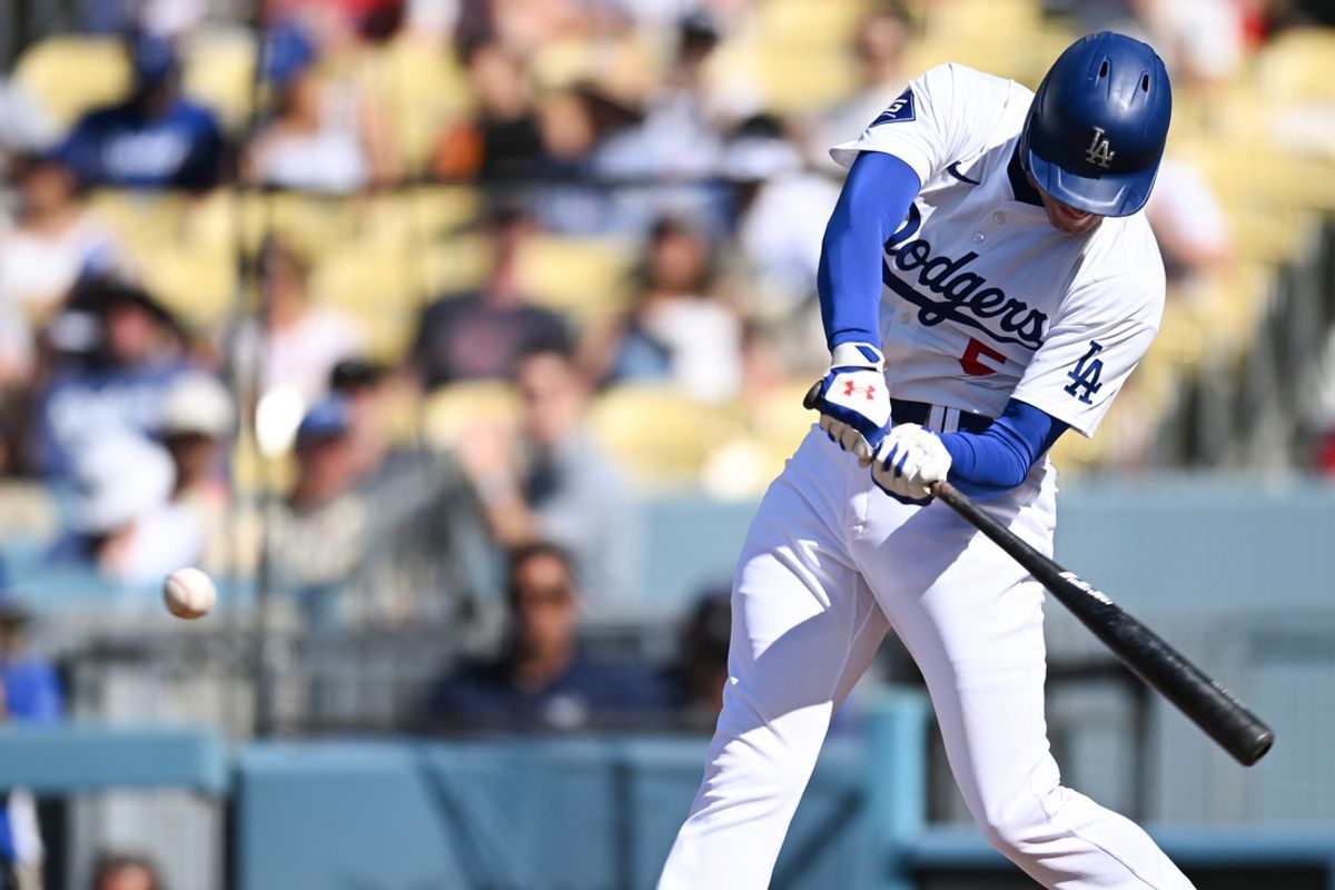 Jul 21, 2024; Los Angeles, California, USA; Los Angeles Dodgers first baseman Freddie Freeman (5) hits a home run against the Boston Red Sox during the first inning at Dodger Stadium. Mandatory Credit: Jonathan Hui-USA TODAY Sports