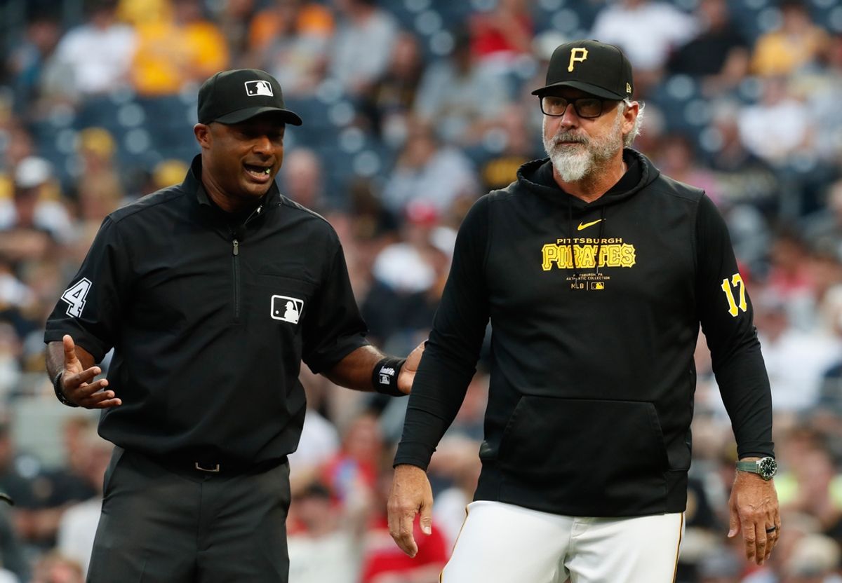 Jul 22, 2024; Pittsburgh, Pennsylvania, USA;  MLB crew chief umpire Alan Porter (64) explains a replay review to Pittsburgh Pirates manager Derek Shelton (17) against the St. Louis Cardinals during the fourth inning at PNC Park. Mandatory Credit: Charles LeClaire-Imagn Images