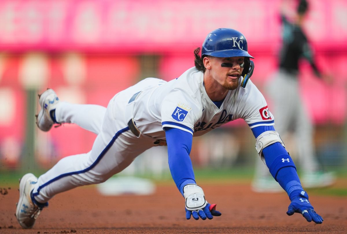Jul 22, 2024; Kansas City, Missouri, USA; Kansas City Royals shortstop Bobby Witt Jr. (7) dives into third base for a triple during the first inning against the Arizona Diamondbacks at Kauffman Stadium. Mandatory Credit: Jay Biggerstaff-USA TODAY Sports