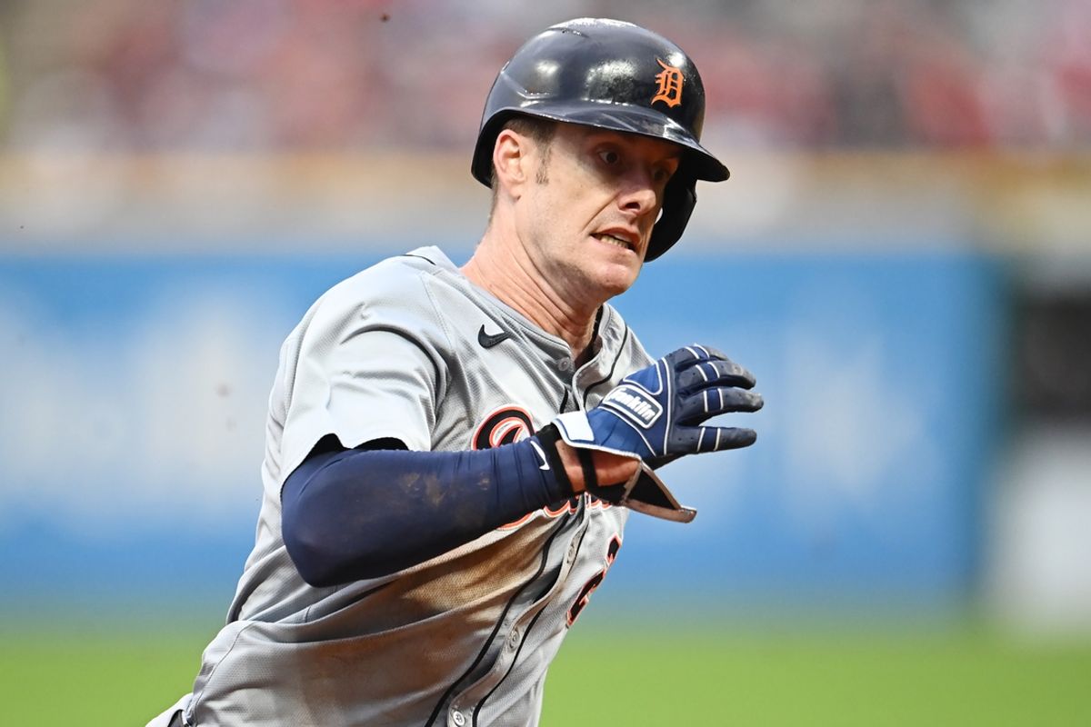 Jul 22, 2024; Cleveland, Ohio, USA; Detroit Tigers left fielder Mark Canha (21) rounds third base en route to scoring during the sixth inning against the Cleveland Guardians at Progressive Field. Mandatory Credit: Ken Blaze-USA TODAY Sports