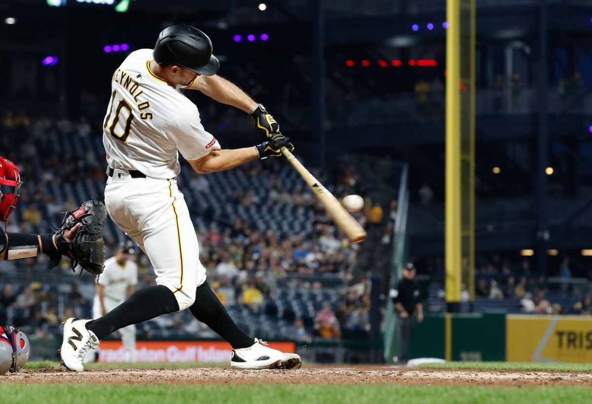 Jul 22, 2024; Pittsburgh, Pennsylvania, USA;  Pittsburgh Pirates left fielder Bryan Reynolds (10) hits a single against the St. Louis Cardinals during the eighth inning at PNC Park. Pittsburgh won 2-1. Mandatory Credit: Charles LeClaire-USA TODAY Sports