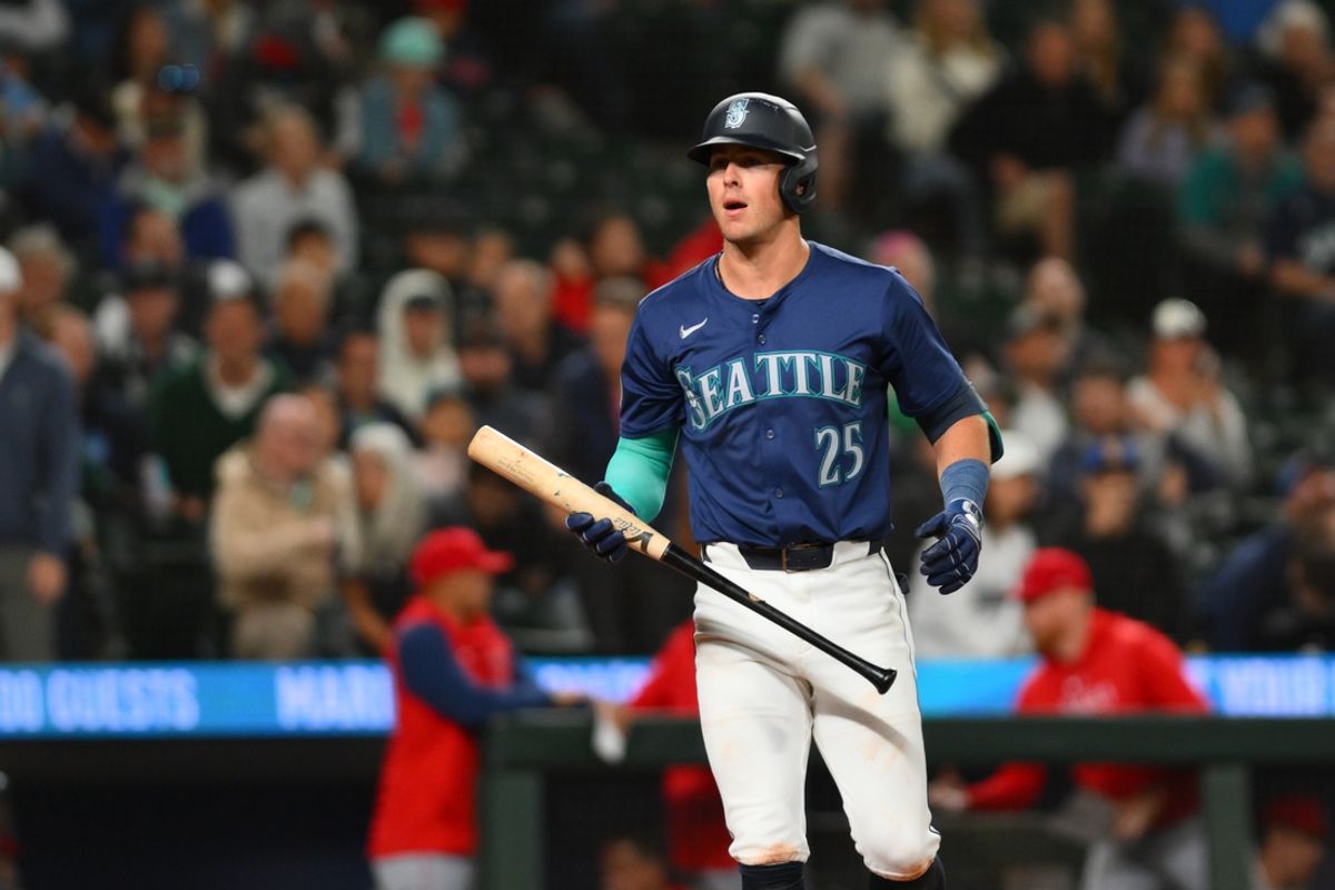Jul 22, 2024; Seattle, Washington, USA; Seattle Mariners shortstop Dylan Moore (25) reacts to striking out to end the game against the Los Angeles Angels at T-Mobile Park. Mandatory Credit: Steven Bisig-USA TODAY Sports