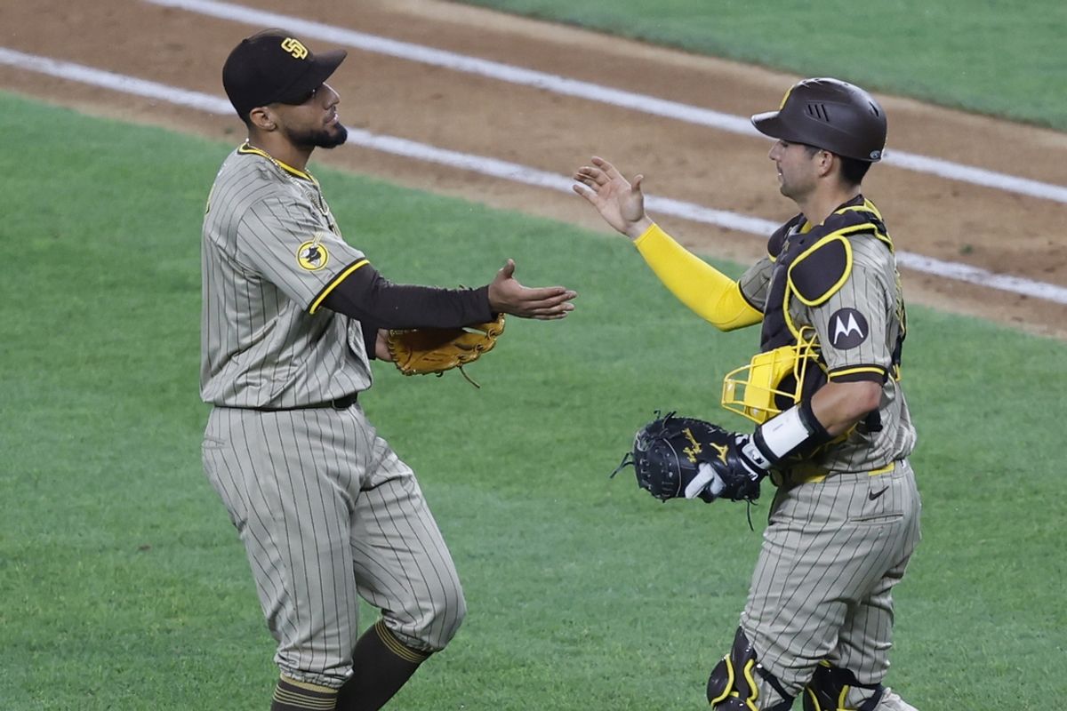 Jul 23, 2024; Washington, District of Columbia, USA; San Diego Padres closing pitcher Robert Suarez (75) celebrates with Padres catcher Kyle Higashioka (20) after the final out against the Washington Nationals at Nationals Park. Mandatory Credit: Geoff Burke-USA TODAY Sports