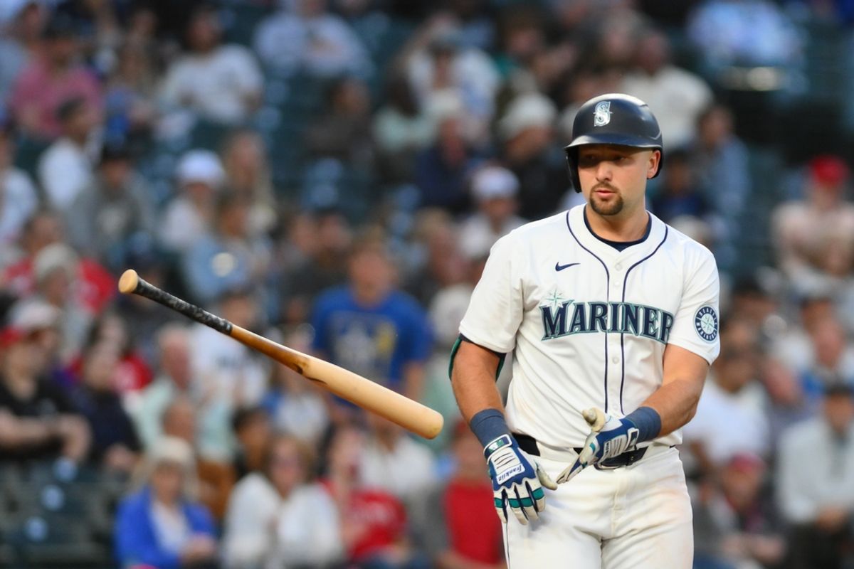 Jul 23, 2024; Seattle, Washington, USA; Seattle Mariners catcher Cal Raleigh (29) throws his bat after walking against the Los Angeles Angels during the eighth inning at T-Mobile Park. Mandatory Credit: Steven Bisig-USA TODAY Sports