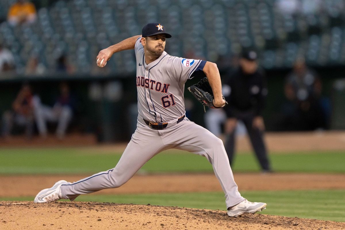 Jul 23, 2024; Oakland, California, USA;  Houston Astros pitcher Seth Martinez (61) pitches during the sixth inning against the Oakland Athletics at Oakland-Alameda County Coliseum. Mandatory Credit: Stan Szeto-Imagn Images
