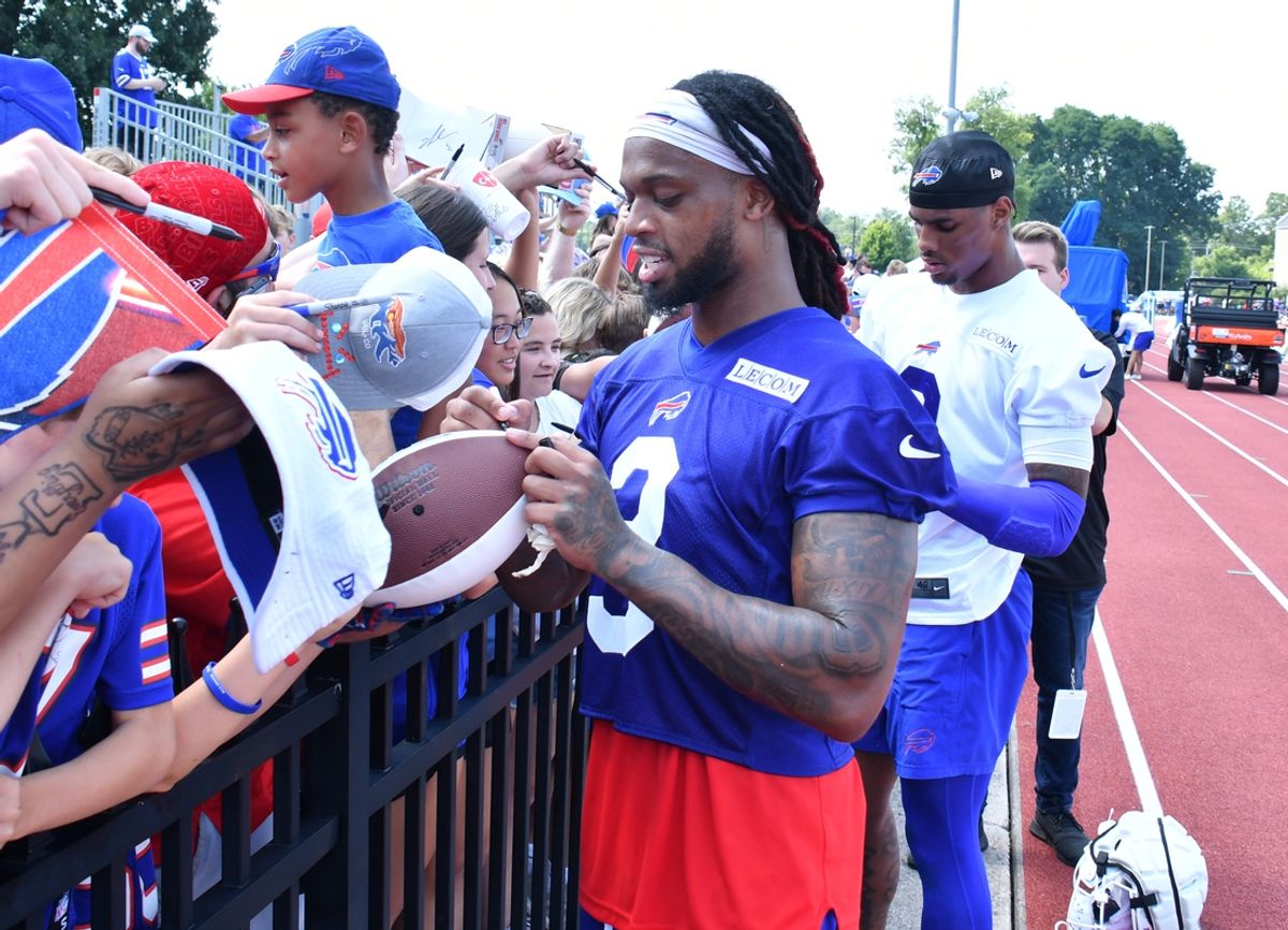 Jul 24, 2024; Rochester, NY, USA; Buffalo Bills safety Damar Hamlin (3) and wide receiver Keon Coleman (0) sign autographs for fans after a training camp session at St. John Fisher University. Mandatory Credit: Mark Konezny-Imagn Images