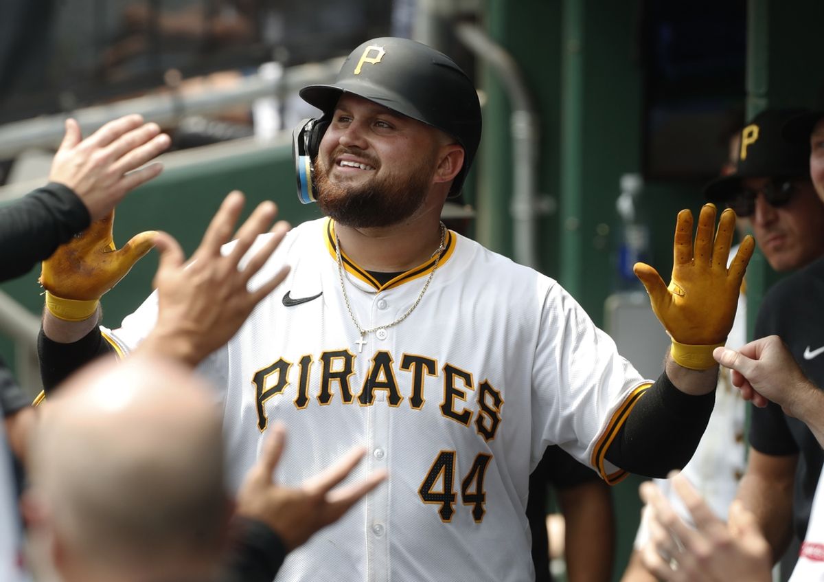 Jul 24, 2024; Pittsburgh, Pennsylvania, USA;  Pittsburgh Pirates first baseman Rowdy Tellez (44) celebrates in the dugout after hitting a solo home run against the St. Louis Cardinals during the fourth inning at PNC Park. Mandatory Credit: Charles LeClaire-USA TODAY Sports