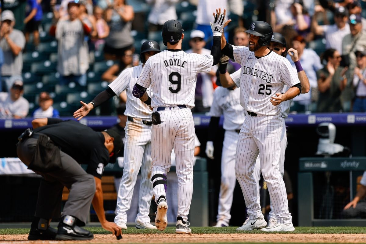 Jul 24, 2024; Denver, Colorado, USA; Colorado Rockies center fielder Brenton Doyle (9) celebrates with catcher Jacob Stallings (25) after hitting a grand slam in the sixth inning against the Boston Red Sox at Coors Field. Mandatory Credit: Isaiah J. Downing-USA TODAY Sports