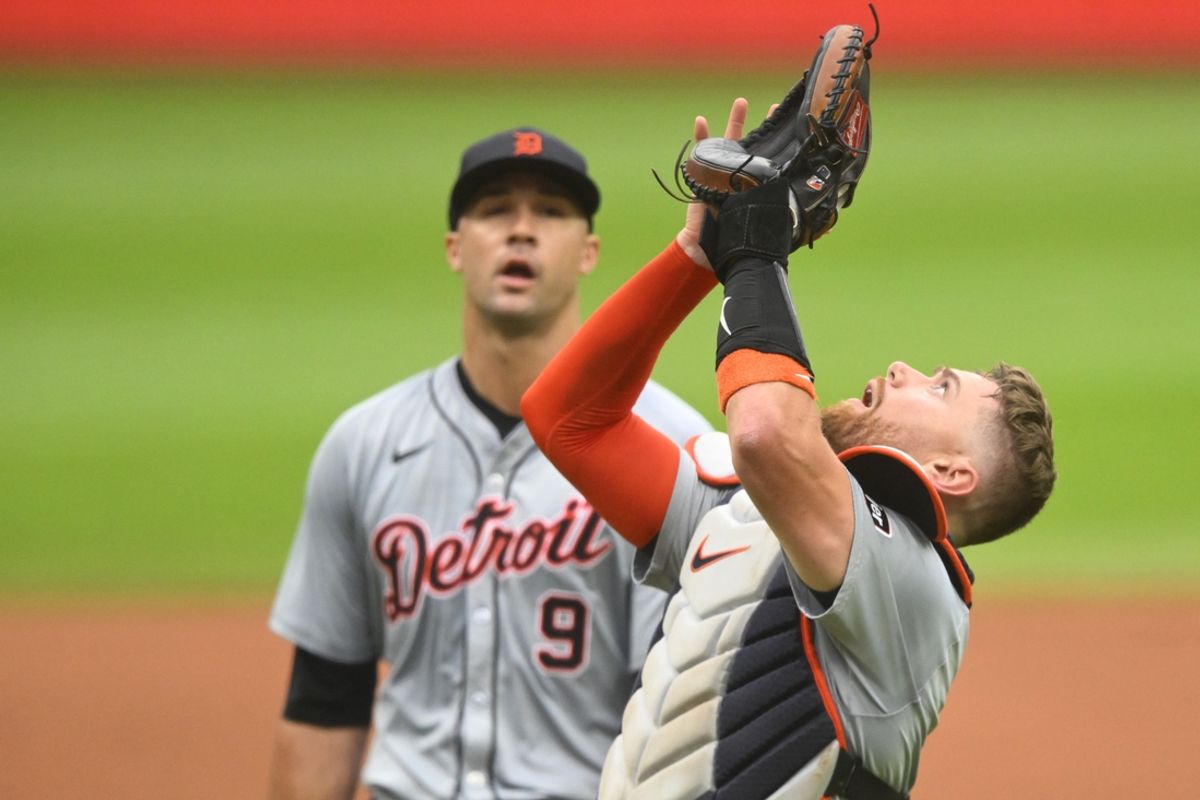 Jul 24, 2024; Cleveland, Ohio, USA; Detroit Tigers catcher Carson Kelly (15) looks for a foul ball beside starting pitcher Jack Flaherty (9) in the first inning against the Cleveland Guardians at Progressive Field. Mandatory Credit: David Richard-USA TODAY Sports