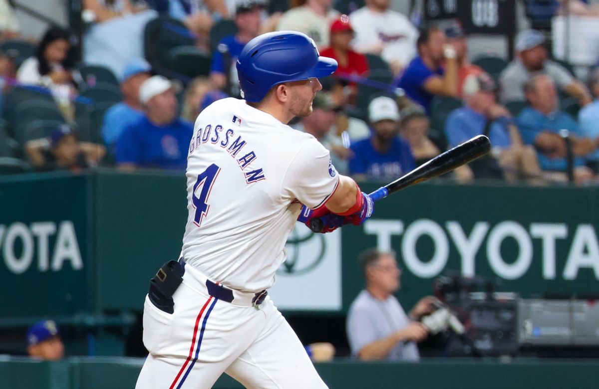 Jul 24, 2024; Arlington, Texas, USA; Texas Rangers right fielder Robbie Grossman (4) hits a home run during the eighth inning against the Chicago White Sox at Globe Life Field. Mandatory Credit: Kevin Jairaj-USA TODAY Sports