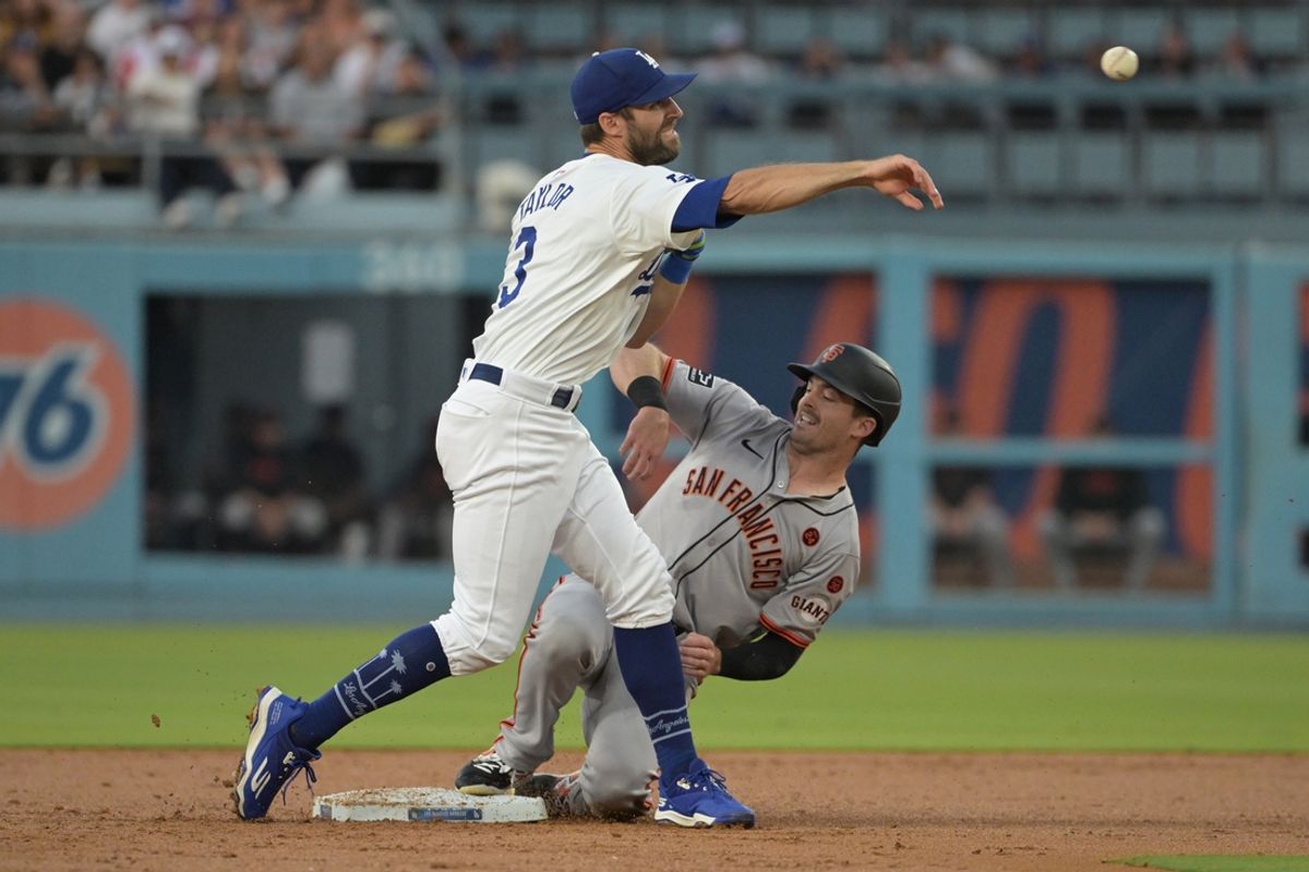 Jul 24, 2024; Los Angeles, California, USA;  Los Angeles Dodgers left fielder Chris Taylor (3) throws to first as San Francisco Giants right fielder Mike Yastrzemski (5) is out on a double play in the second inning at Dodger Stadium. Mandatory Credit: Jayne Kamin-Oncea-USA TODAY Sports