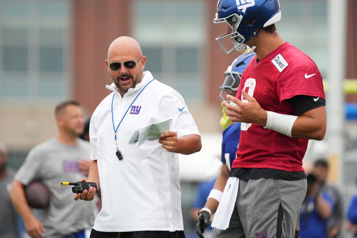 Jul 25, 2024; East Rutherford, NY, USA; New York Giants head coach Brian Daboll speaks with quarterback Daniel Jones (8) during training camp at Quest Diagnostics Training Center. Mandatory Credit: Lucas Boland-Imagn Images