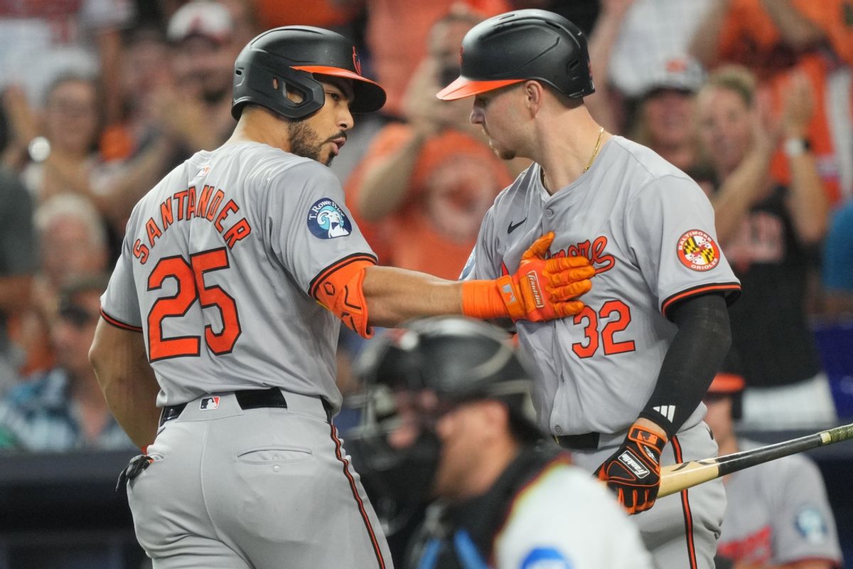 Jul 25, 2024; Miami, Florida, USA;  Baltimore Orioles right fielder Anthony Santander (25) celebrates with designated hitter Ryan O'Hearn (32) after hitting a solo home run against the Miami Marlins in the first inning at loanDepot Park. Mandatory Credit: Jim Rassol-USA TODAY Sports