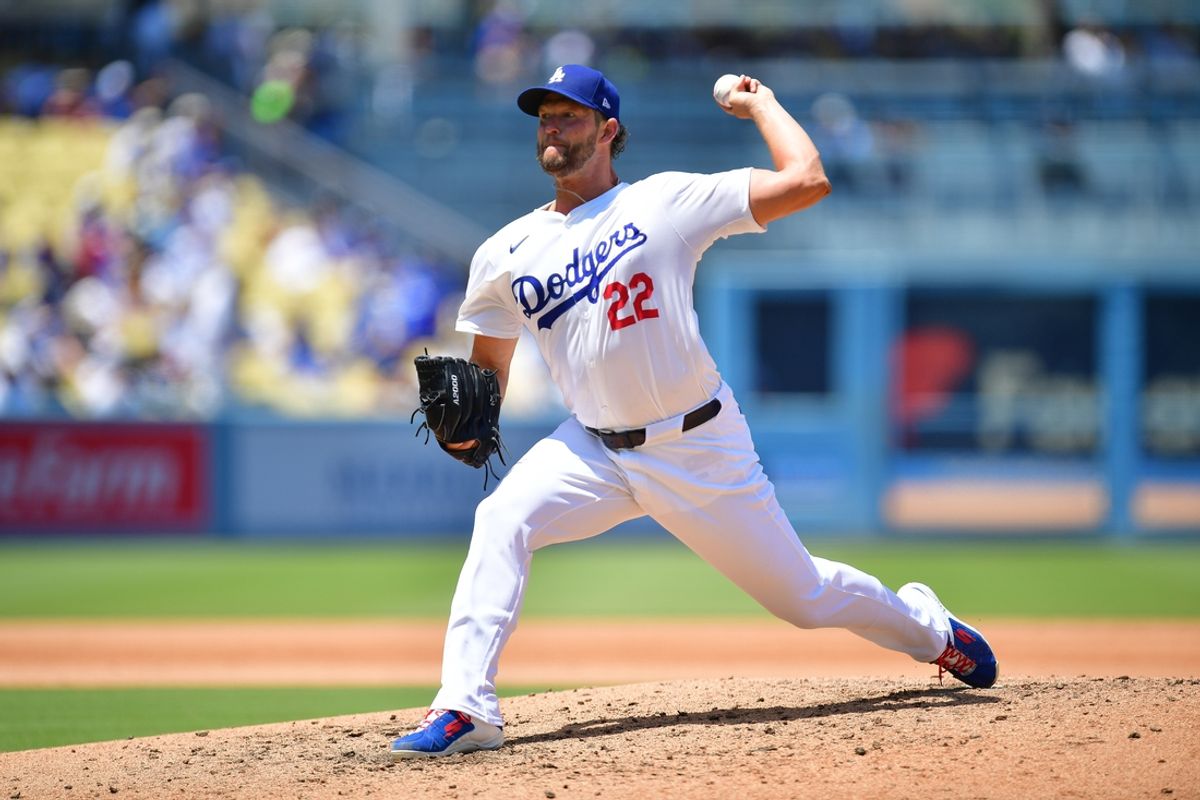 Jul 25, 2024; Los Angeles, California, USA; Los Angeles Dodgers starting pitcher Clayton Kershaw (22) throws against the San Francisco Giants during the fourth inning at Dodger Stadium. Mandatory Credit: Gary A. Vasquez-Imagn Images