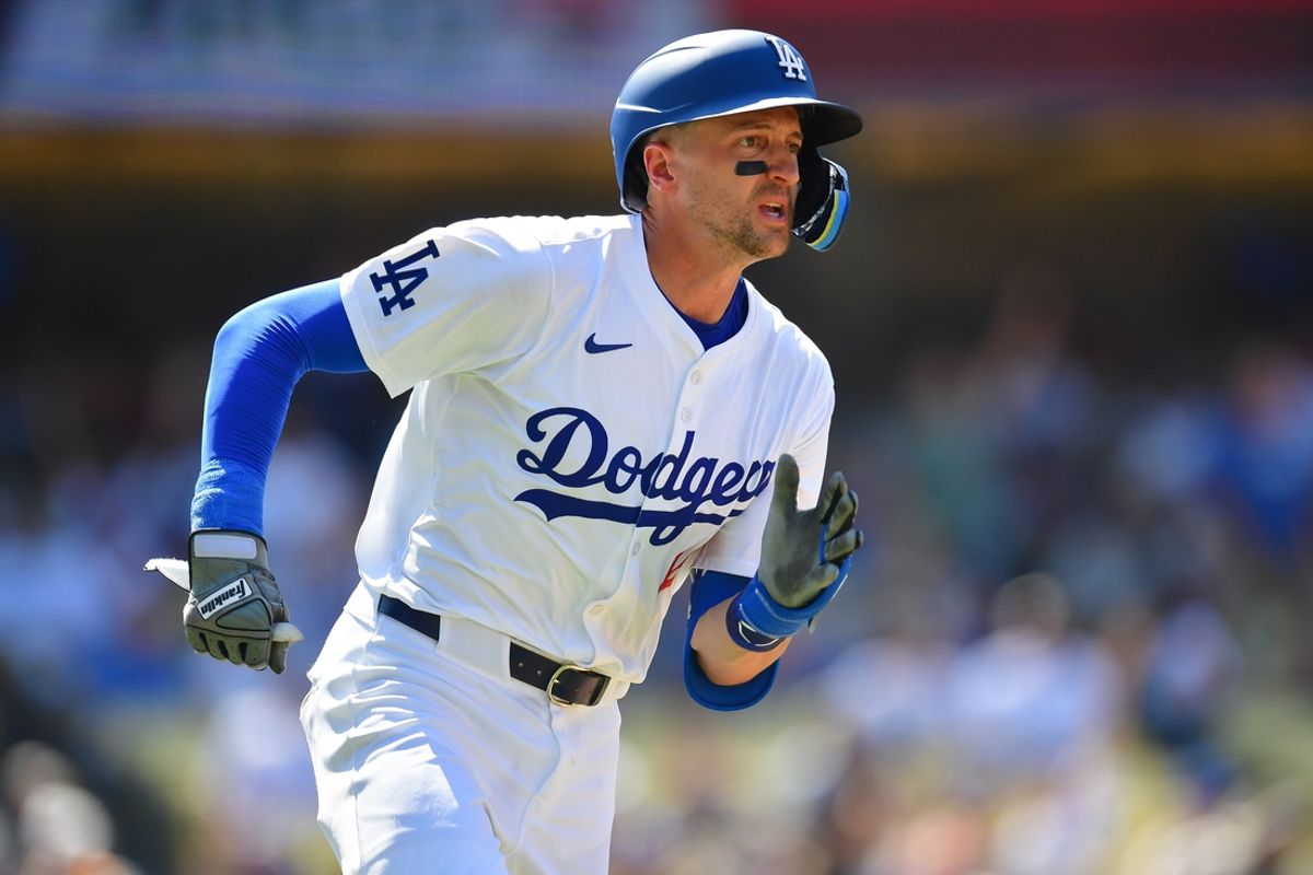 Jul 25, 2024; Los Angeles, California, USA; Los Angeles Dodgers shortstop Nick Ahmed (12) runs after hitting a solo home run against the San Francisco Giants during the eighth inning at Dodger Stadium. Mandatory Credit: Gary A. Vasquez-Imagn Images