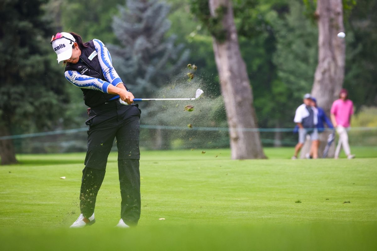 Jul 25, 2024; Calgary, Alberta, CAN; A Lim Kim plays her shot on the tenth hole during the first round of the CPKC Women's Open golf tournament. Mandatory Credit: Sergei Belski-Imagn Images