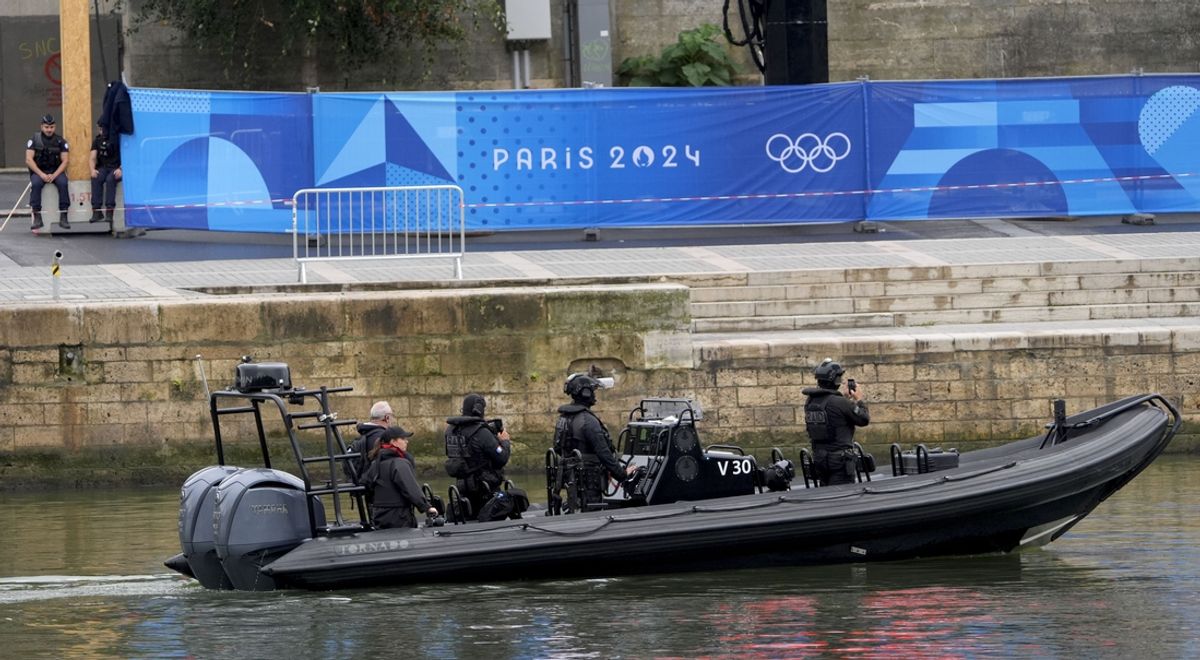 Jul 26, 2024; Paris, FRANCE; Security patrols the river ahead of the Opening Ceremony for the Paris 2024 Olympic Summer Games along the Seine River. Mandatory Credit: Andrew P. Scott-USA TODAY Sports