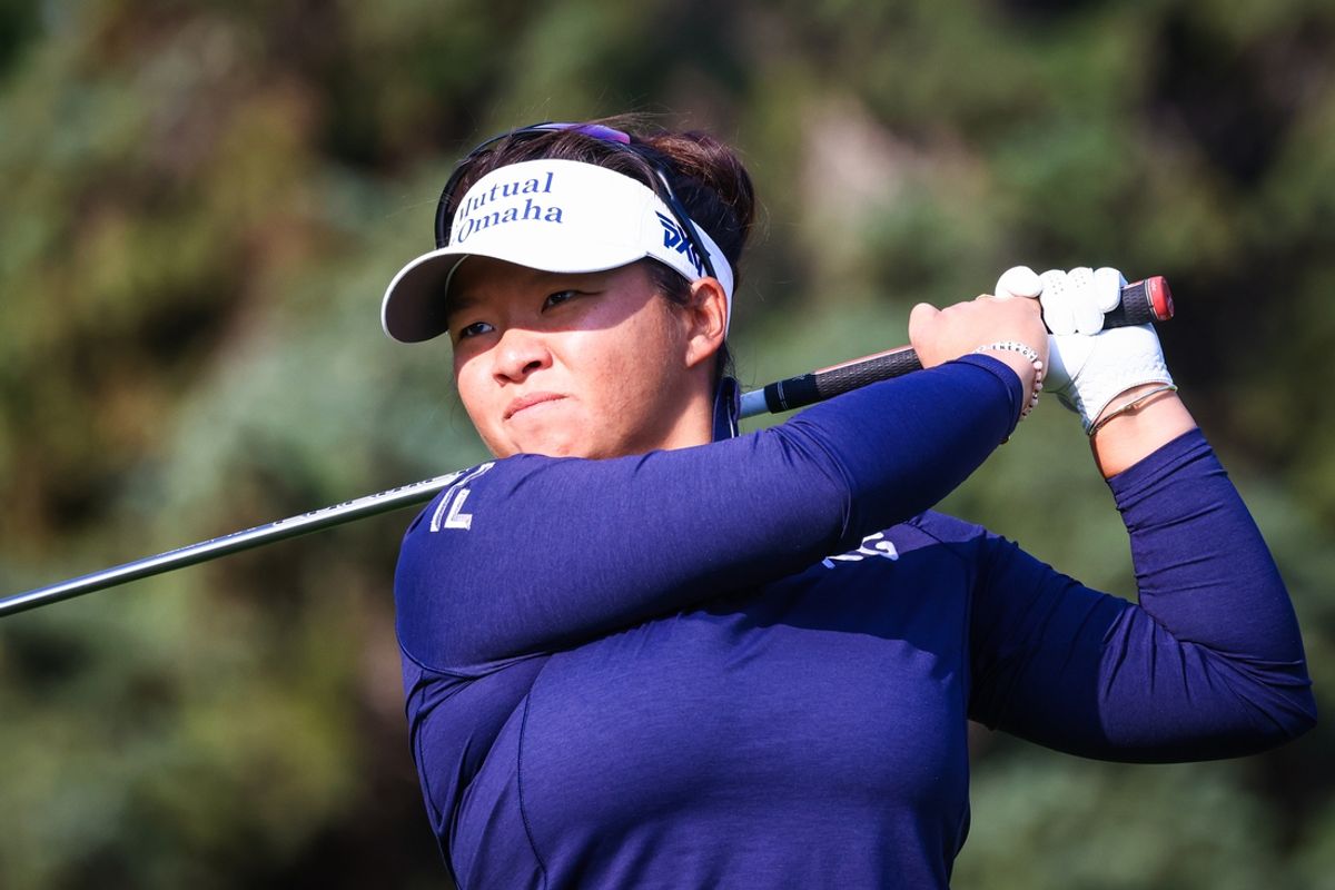 Jul 26, 2024; Calgary, Alberta, CAN; Megan Khang plays her shot from the 14th tee during the second round of the CPKC Women's Open golf tournament. Mandatory Credit: Sergei Belski-USA TODAY Sports