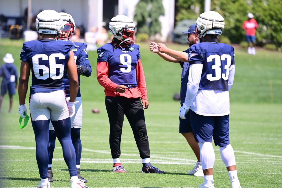 Jul 26, 2024; Foxborough, MA, USA; New England Patriots linebacker Matthew Judon (9) works with members of the coaching staff during training camp at Gillette Stadium. Mandatory Credit: Eric Canha-USA TODAY Sports