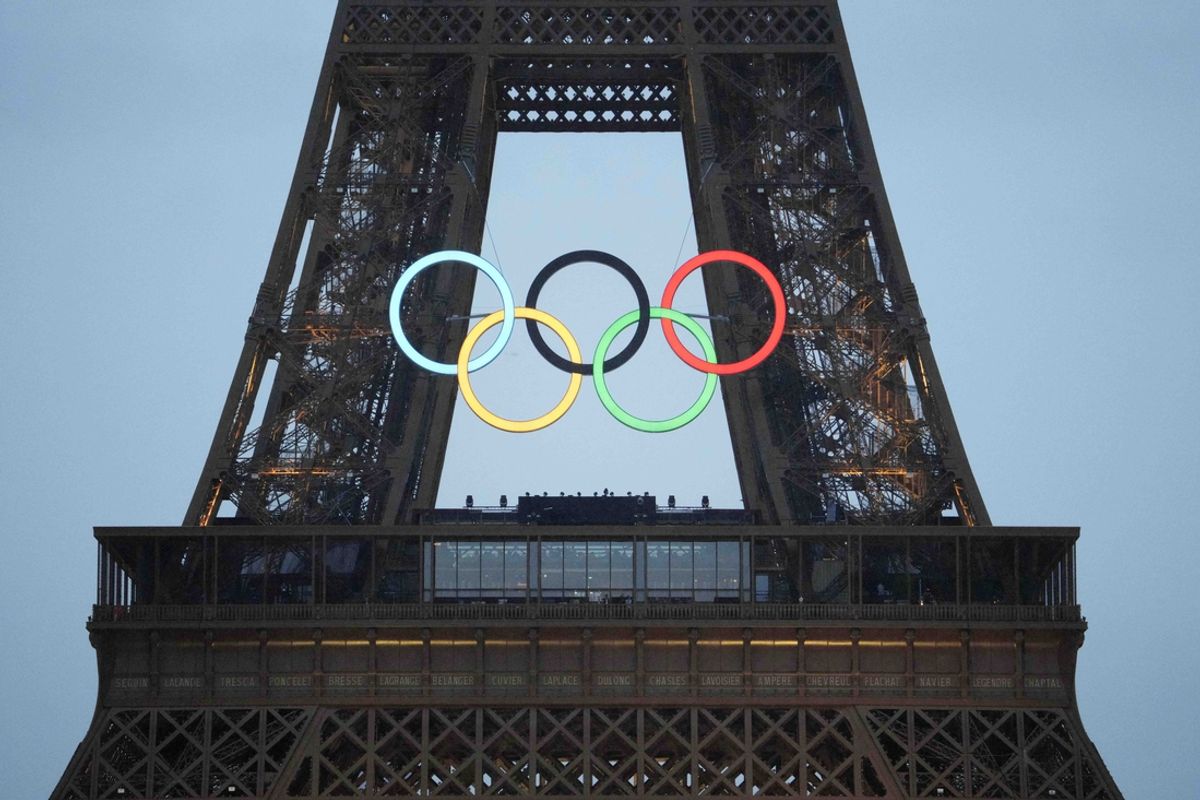 Jul 26, 2024; Paris, FRANCE; The Olympic rings on the Eiffel Tower light up during the Opening Ceremony for the Paris 2024 Olympic Summer Games along the Seine River. Mandatory Credit: Rob Schumacher-USA TODAY Sports
