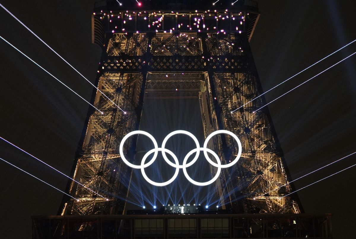Jul 26, 2024; Paris, FRANCE;  Celine Dion performs under the Olympic rings on the Eiffel Tower during the Opening Ceremony for the Paris 2024 Olympic Summer Games along the Seine River. Mandatory Credit: Andrew P. Scott-USA TODAY Sports