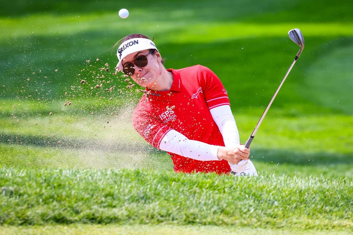 Jul 26, 2024; Calgary, Alberta, CAN; Hannah Green plays her shot from a bunker on the fourth hole during the second round of the CPKC Women's Open golf tournament. Mandatory Credit: Sergei Belski-Imagn Images