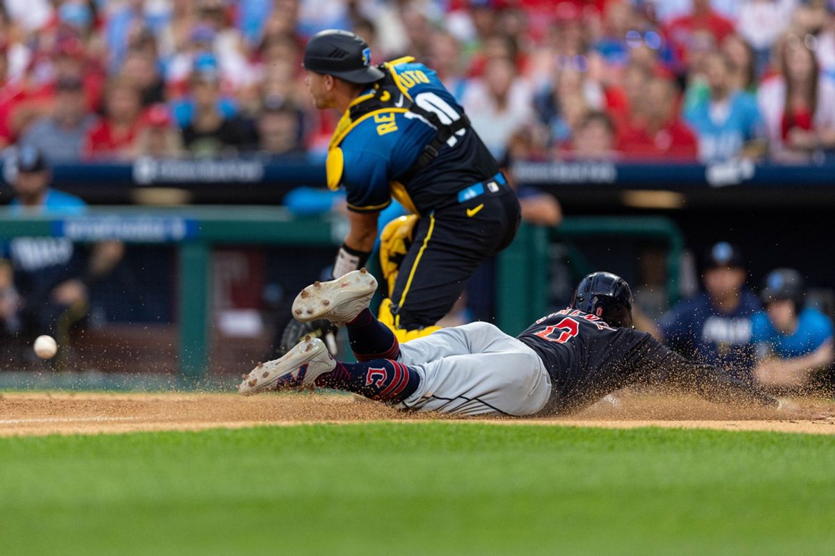 Jul 26, 2024; Philadelphia, Pennsylvania, USA; Cleveland Guardians second base Andrés Giménez (0) scores past Philadelphia Phillies catcher J.T. Realmuto (10) during the fourth inning at Citizens Bank Park. Mandatory Credit: Bill Streicher-USA TODAY Sports
