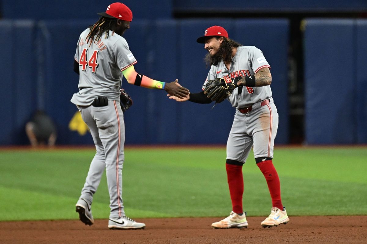Jul 26, 2024; St. Petersburg, Florida, USA; Cincinnati Reds second baseman Jonathan India (6) and short stop Elly De La Cruz (44) celebrate  after defeating the Tampa Bay Rays at Tropicana Field. Mandatory Credit: Jonathan Dyer-USA TODAY Sports