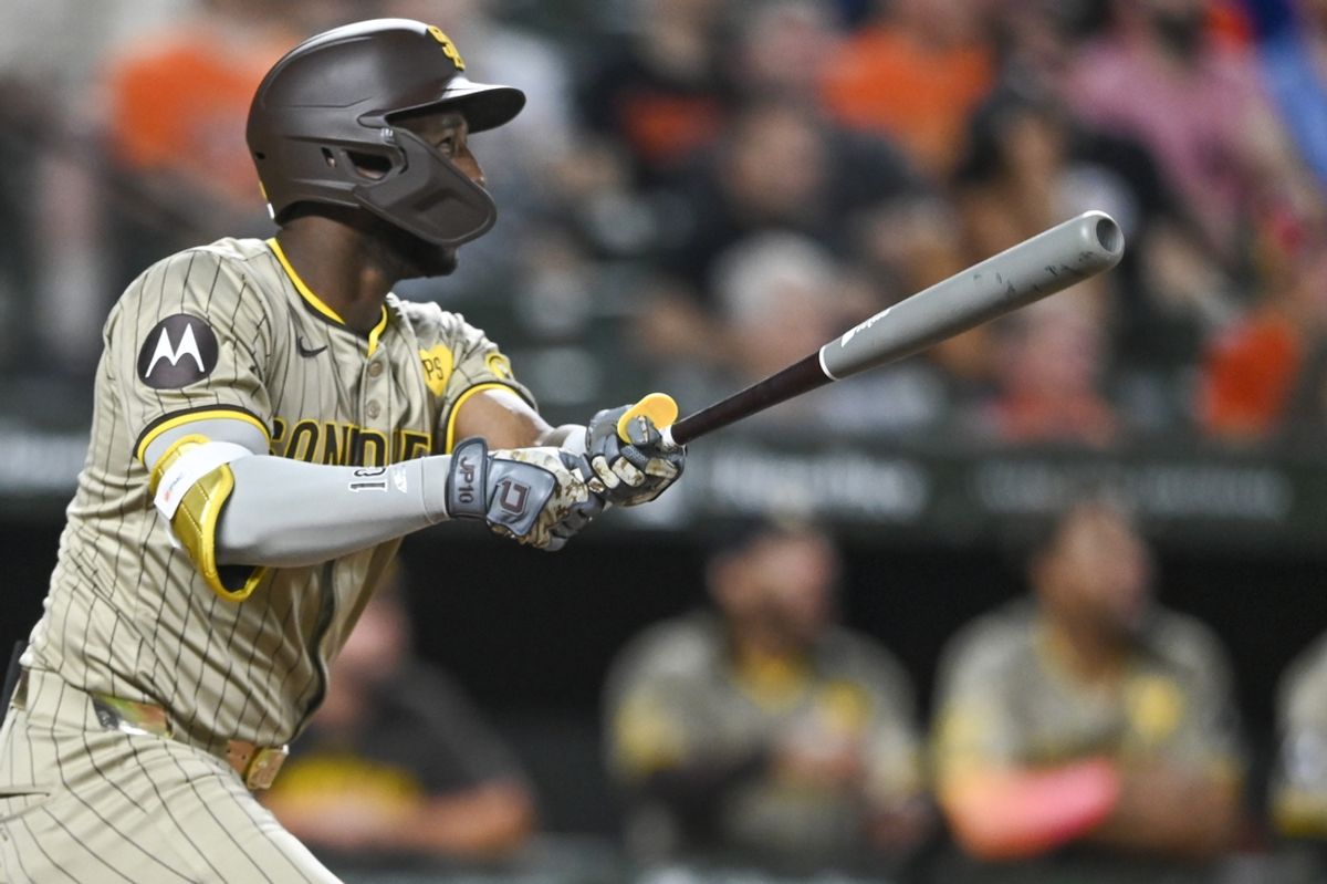 Jul 26, 2024; Baltimore, Maryland, USA;  San Diego Padres outfielder Jurickson Profar (10) swings through a ninth inning two run home run against the Baltimore Orioles at Oriole Park at Camden Yards. Mandatory Credit: Tommy Gilligan-USA TODAY Sports