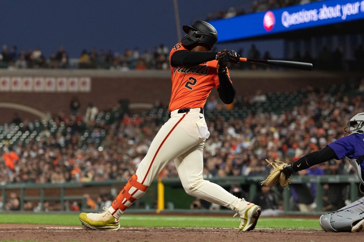 Jul 26, 2024; San Francisco, California, USA;  San Francisco Giants designated hitter Jorge Soler (2) hits a RBI single during the fourth inning against the Colorado Rockies at Oracle Park. Mandatory Credit: Stan Szeto-USA TODAY Sports