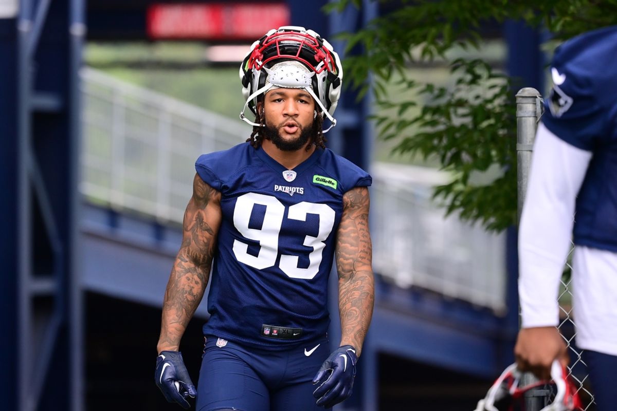 Jul 24, 2024; Foxborough, MA, USA; New England Patriots linebacker Oshane Ximines (93) walks to the practice field during training camp at Gillette Stadium. Mandatory Credit: Eric Canha-Imagn Images
