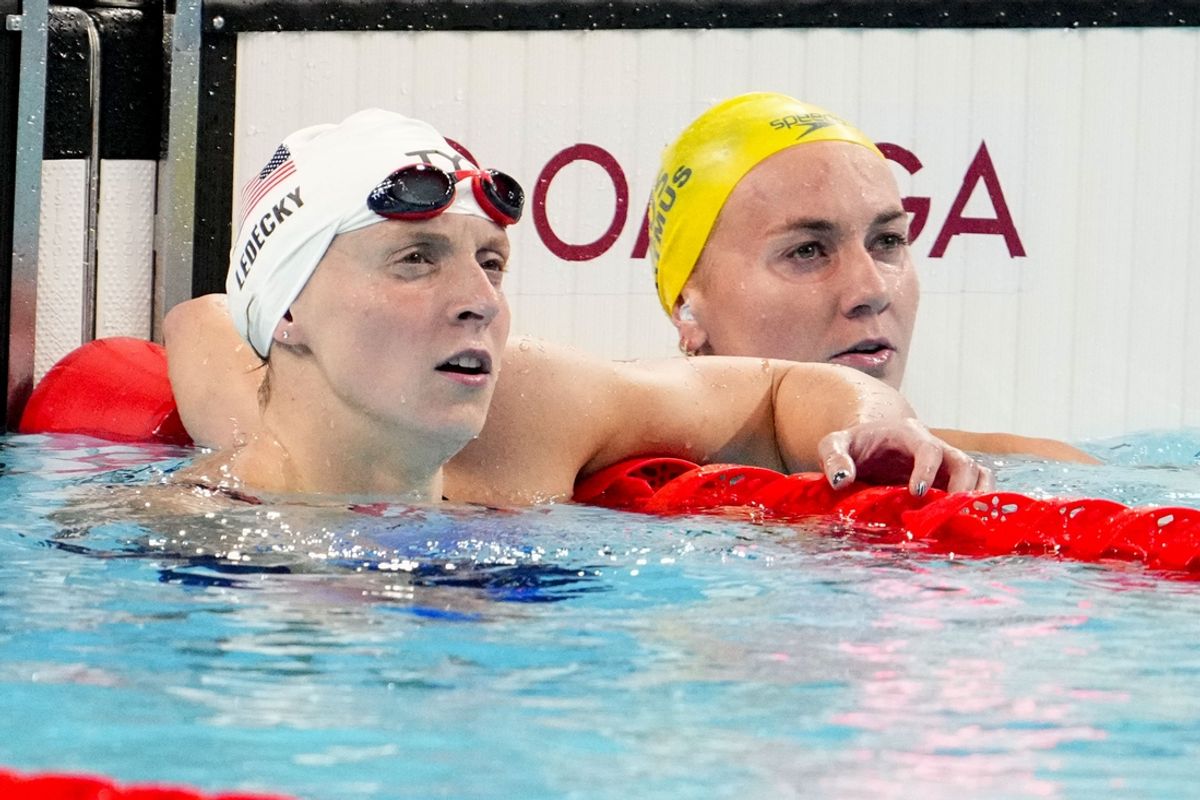 Jul 27, 2024; Nanterre, France; Katie Ledecky (USA) and Ariarne Titmus (Australia) in the women’s 400-meter freestyle preliminary heats during the Paris 2024 Olympic Summer Games at Paris La Défense Arena. Mandatory Credit: Rob Schumacher-USA TODAY Sports